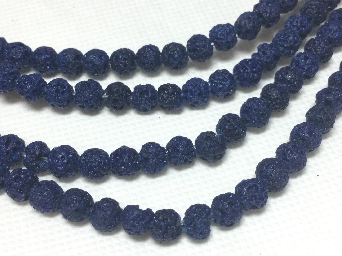 #2753 / Natural Lava 4-4.5mm Navy (Dyed) Round Beads / .8mm Hole / 8" Strand