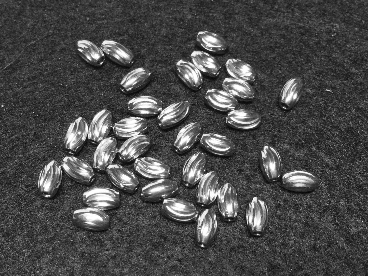 #2870 / 304 Stainless Steel Corrugated Oval Beads / 5x3mm / 1.2mm Hole / Lot of 10
