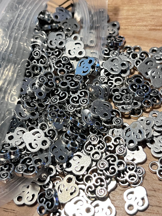 #2453 Antique Silvertone Scroll Charms / 10x8x2mm / Lead-Cadmium-Nickel Free / 1.5mm Loop / Sold in Lot of 50